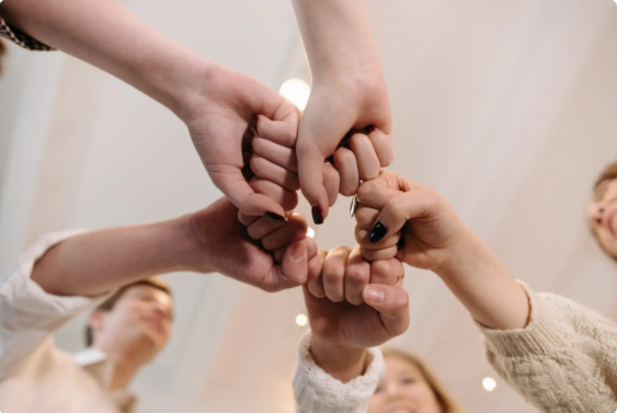 Hands joined together in unity, representing the BridgePoint community.